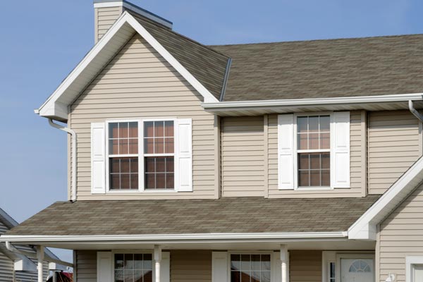 Residential Home With Vinyl Siding, Gable Roof, Seamless Gutters, Shutters