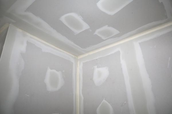 Drywall panels with mud on the joints