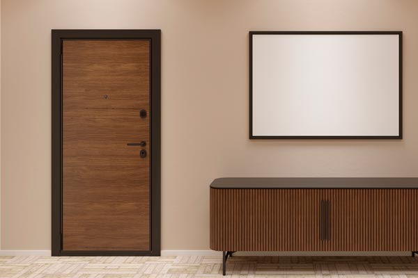 Beige modern hallway interior with an entrance door, a blank mockup poster, a wardrobe and parquet floor. Front view.